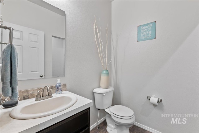 1430 NE Quigley St, Mountain Home, ID 83647 - bathroom with toilet, vanity, and wood finished floors