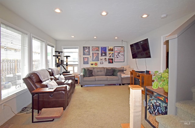 living area featuring recessed lighting and carpet flooring