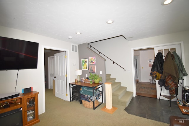 interior space with visible vents, recessed lighting, stairs, and carpet floors