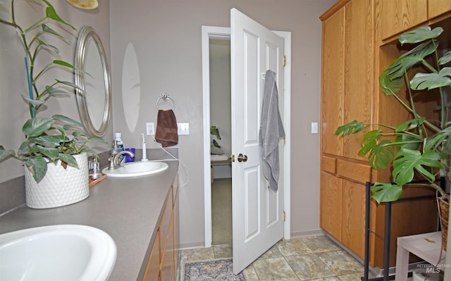 bathroom with double vanity and a sink