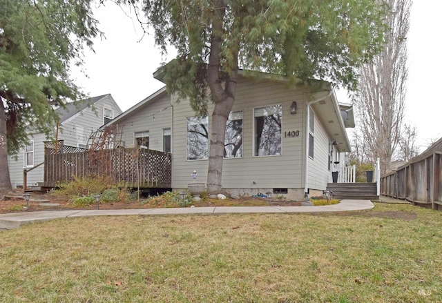 exterior space featuring a yard and fence