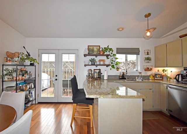 kitchen featuring light wood-type flooring, open shelves, french doors, a peninsula, and dishwasher