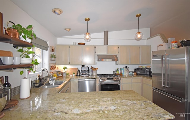 kitchen featuring light stone counters, a sink, hanging light fixtures, stainless steel appliances, and under cabinet range hood