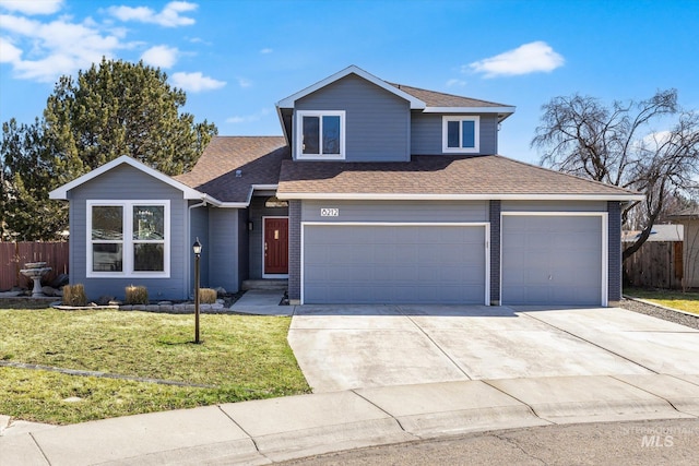 traditional-style house with a shingled roof, concrete driveway, a front lawn, and fence