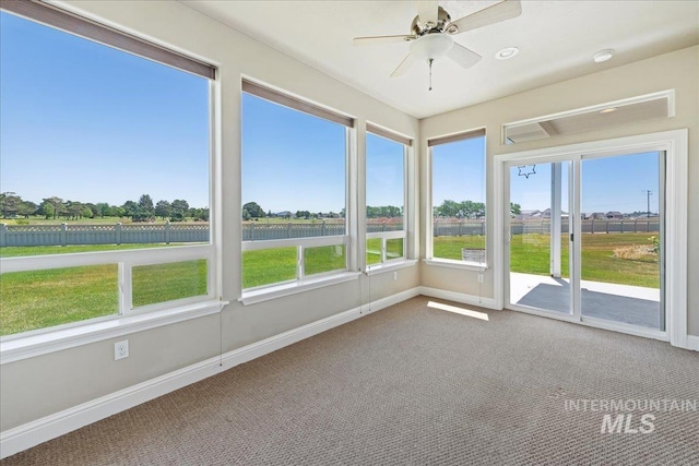 25090 The Driving Ln, Caldwell, ID 83607 - unfurnished sunroom with a ceiling fan, a water view, and healthy amount of natural light