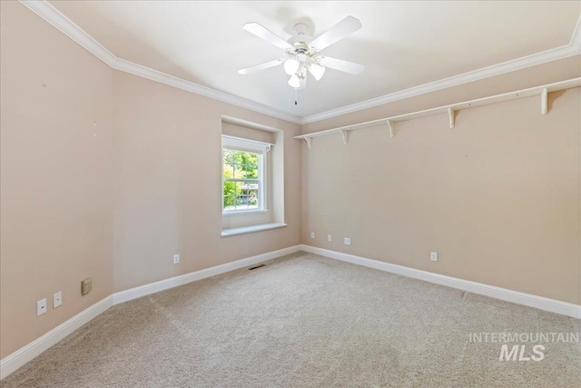 25090 The Driving Ln, Caldwell, ID 83607 - empty room featuring light carpet, ornamental molding, and a ceiling fan