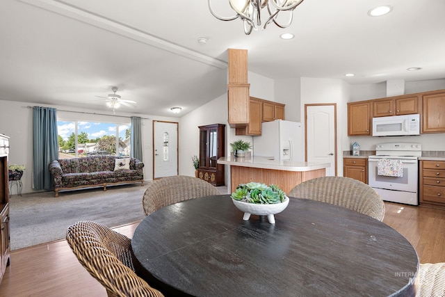 1320 American Ln, Emmett, ID 83617 - dining space featuring a chandelier, light wood finished floors, recessed lighting, vaulted ceiling, and ceiling fan