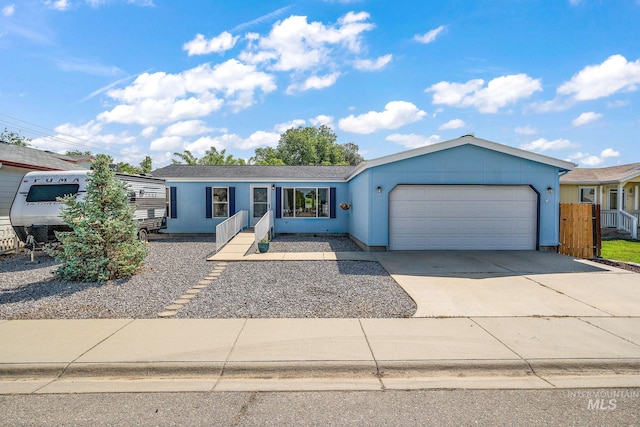 1320 American Ln, Emmett, ID 83617 - ranch-style house with a garage, concrete driveway, and stucco siding