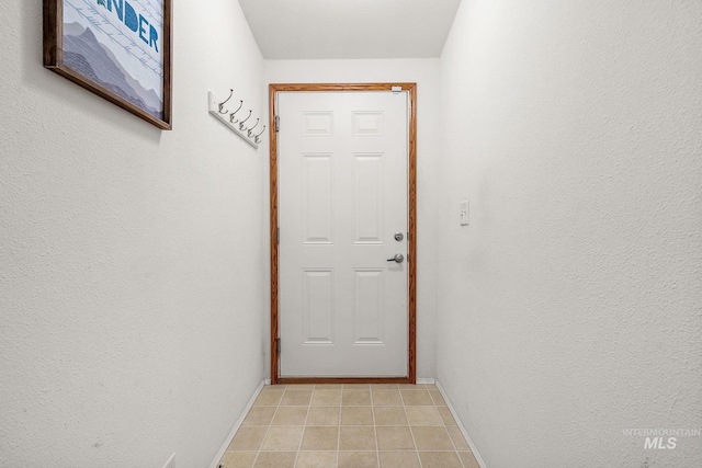 1320 American Ln, Emmett, ID 83617 - doorway with baseboards and light tile patterned floors