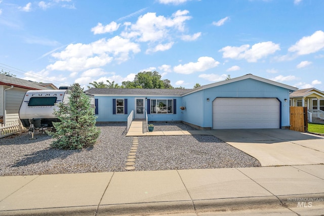 1320 American Ln, Emmett, ID 83617 - single story home featuring a garage, driveway, and stucco siding