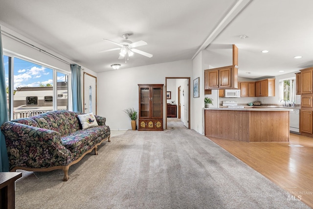 1320 American Ln, Emmett, ID 83617 - living room featuring vaulted ceiling, a ceiling fan, recessed lighting, and light carpet