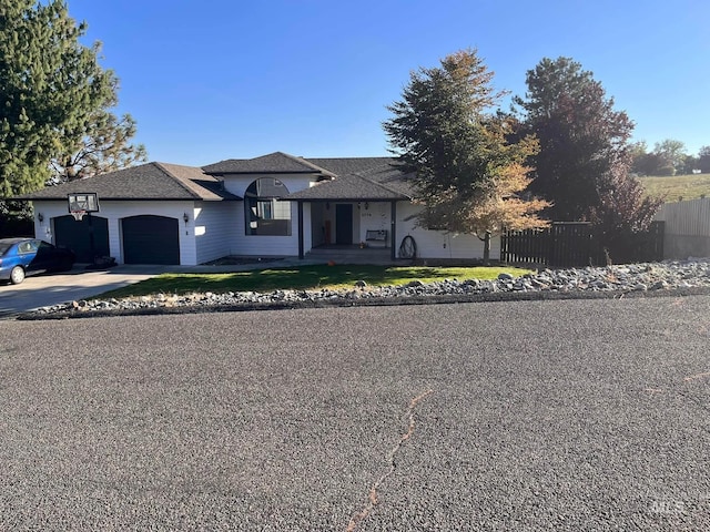 view of front of house with a front yard and a garage