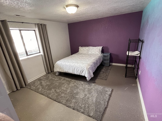 bedroom featuring a textured ceiling