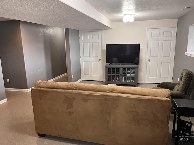 living room featuring a textured ceiling