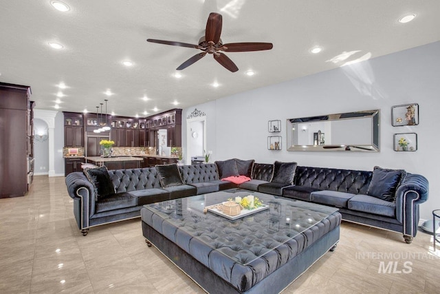 living room with ceiling fan