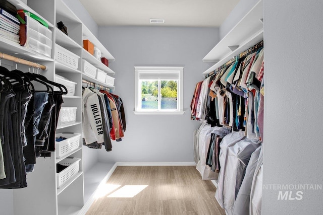 walk in closet featuring light wood-type flooring