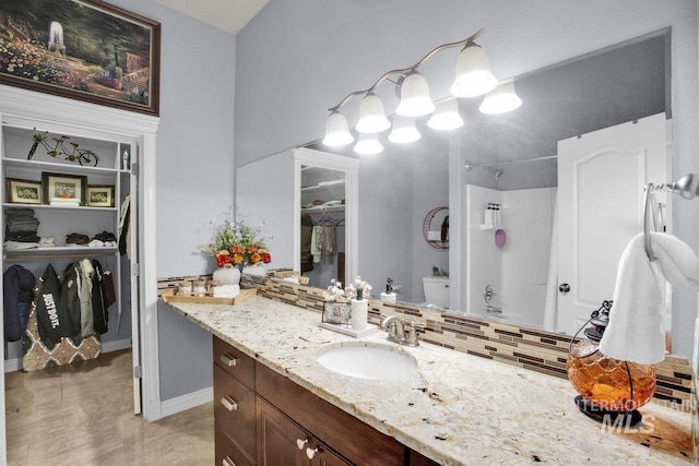 full bathroom with shower / bathing tub combination, tasteful backsplash, vanity, toilet, and tile patterned floors