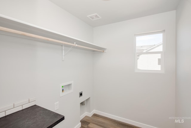 laundry area with washer hookup, visible vents, electric dryer hookup, laundry area, and baseboards