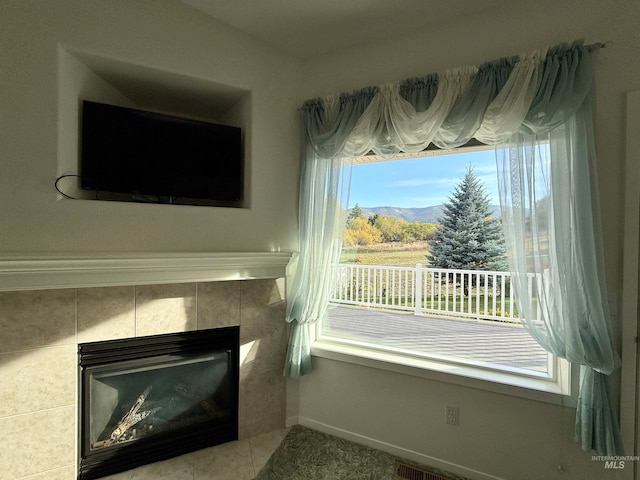 interior space featuring a tiled fireplace