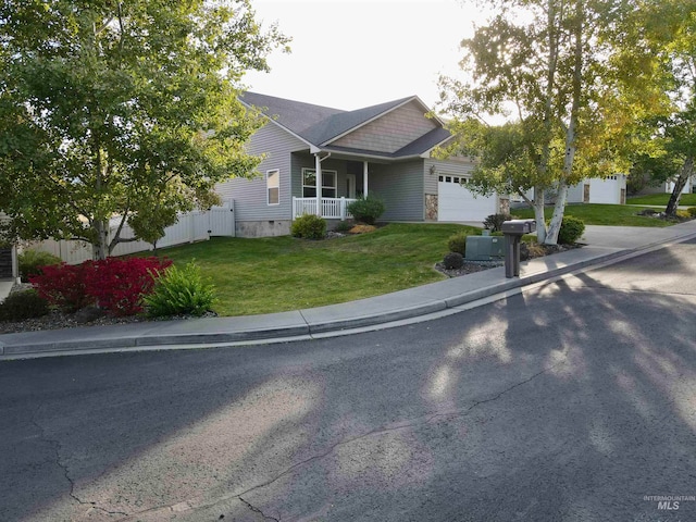 view of front facade with a front yard and a garage