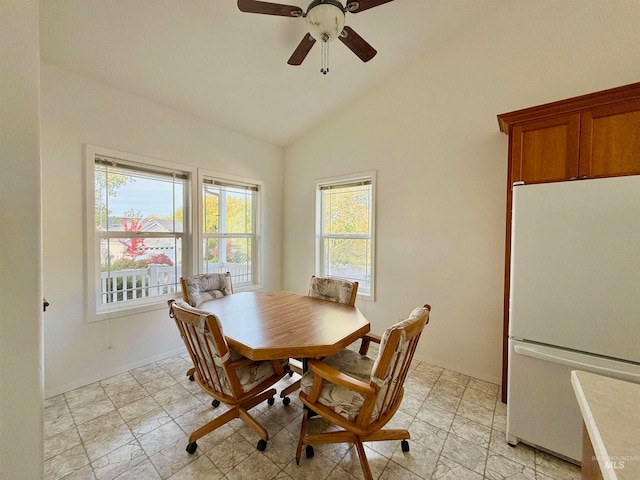 dining room with lofted ceiling and ceiling fan