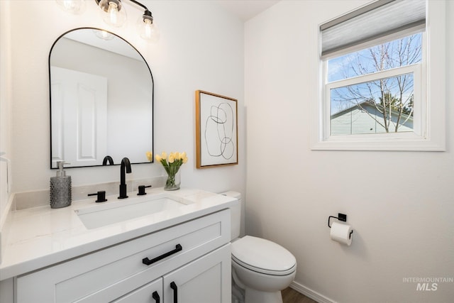 bathroom with vanity and toilet