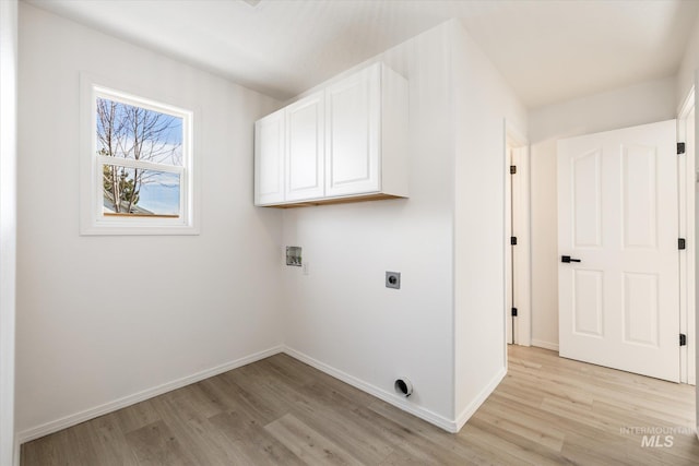 washroom featuring electric dryer hookup, light wood-type flooring, baseboards, and washer hookup