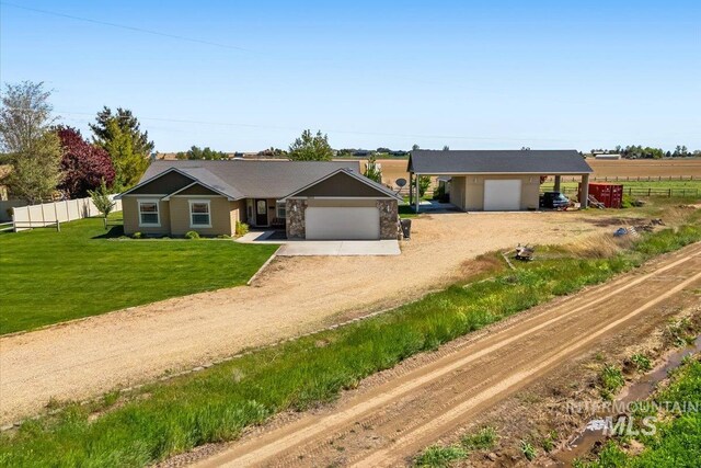 19250 Quarter Mile Ln, Caldwell, ID 83607 - ranch-style home featuring driveway, a garage, and a carport