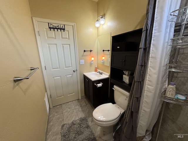 full bath with a shower with curtain, toilet, vanity, and tile patterned flooring