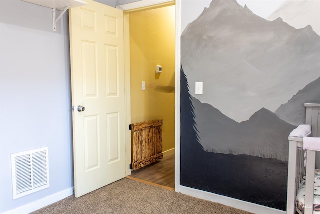 bedroom with visible vents, carpet floors, and baseboards