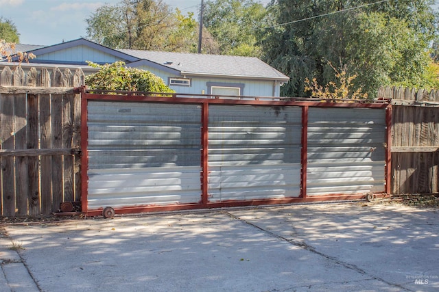 view of gate with fence