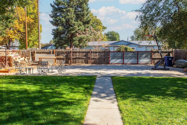 view of yard with a patio area and a fenced backyard