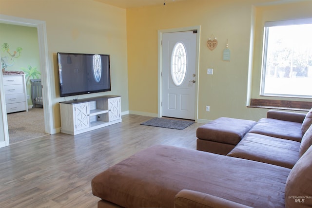 living room featuring baseboards and wood finished floors