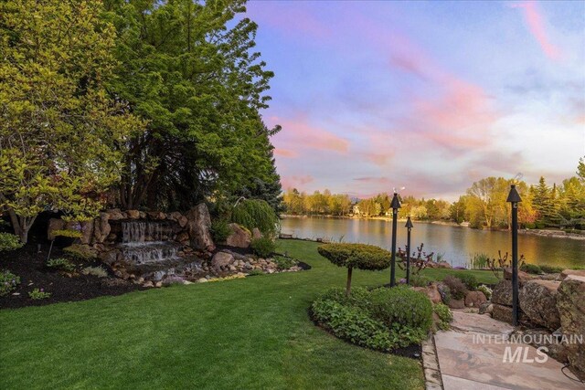 1122 W Two Rivers Ln, Eagle, ID 83616 - view of property's community with a water view and a lawn