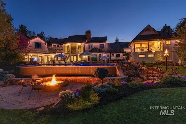 1122 W Two Rivers Ln, Eagle, ID 83616 - view of pool featuring a fire pit and a patio area