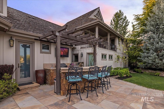 1122 W Two Rivers Ln, Eagle, ID 83616 - patio terrace at dusk featuring a pergola, a patio area, and a yard