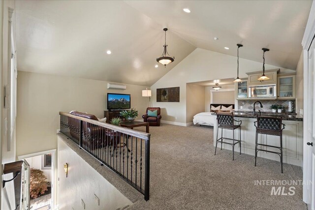 1122 W Two Rivers Ln, Eagle, ID 83616 - living room with vaulted ceiling, carpet flooring, baseboards, and recessed lighting