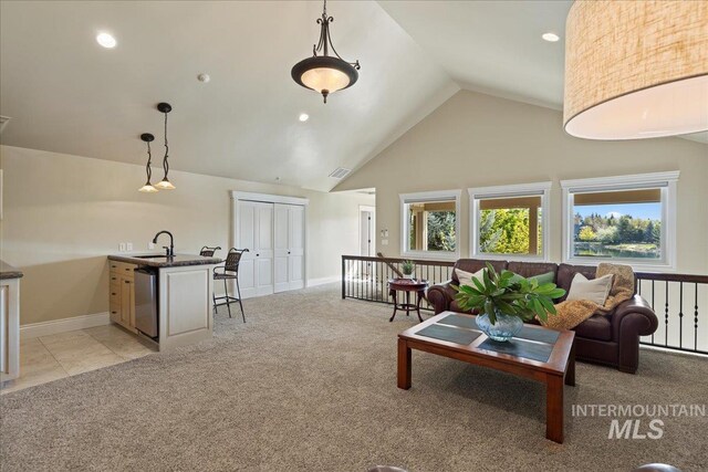 1122 W Two Rivers Ln, Eagle, ID 83616 - living area featuring light colored carpet, baseboards, high vaulted ceiling, and recessed lighting