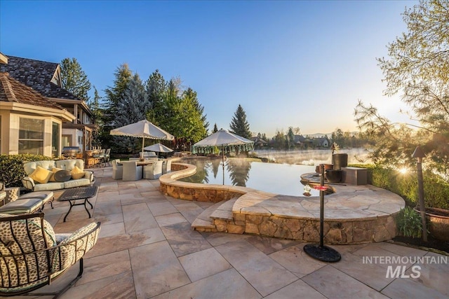 1122 W Two Rivers Ln, Eagle, ID 83616 - patio terrace at dusk featuring a patio area