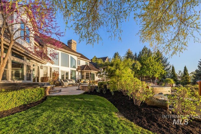 1122 W Two Rivers Ln, Eagle, ID 83616 - view of green lawn featuring a patio