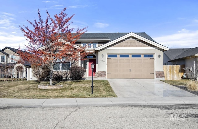 view of front of home with a garage and a front yard