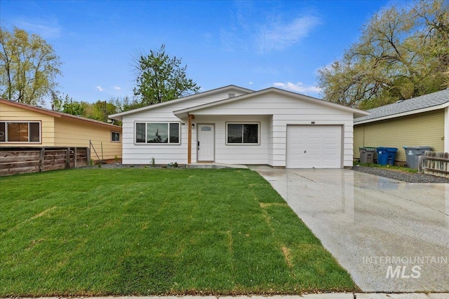 single story home featuring concrete driveway, fence, a front lawn, and a garage