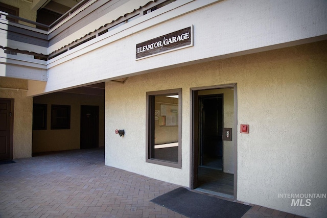 351 S 2nd Ave Unit 602, Ketchum, ID 83340 - entrance to property featuring stucco siding and a patio