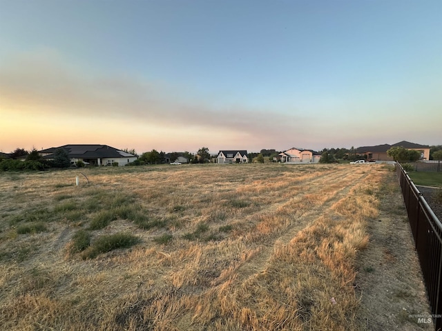 view of yard featuring a residential view and fence