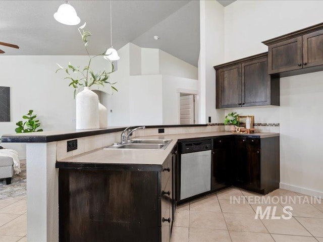 kitchen with a sink, stainless steel dishwasher, dark brown cabinetry, and light tile patterned floors