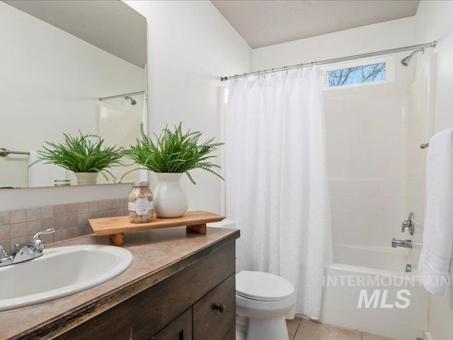 bathroom featuring shower / bath combo with shower curtain, toilet, backsplash, tile patterned flooring, and vanity