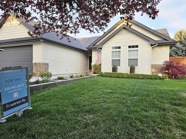 ranch-style house with an attached garage, stone siding, a front lawn, and fence
