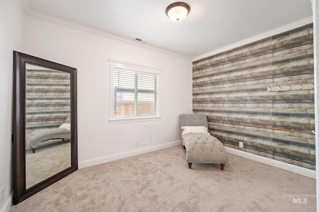 unfurnished room featuring wood walls, baseboards, carpet, and ornamental molding