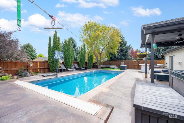 view of pool featuring a patio area, a fenced backyard, a fenced in pool, and outdoor lounge area