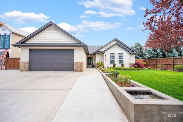 view of front facade featuring driveway, fence, and stone siding